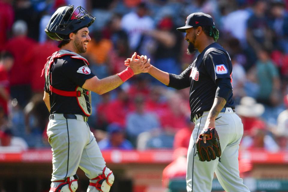 Guardians catcher Austin Hedges and pitcher Emmanuel Clase celebrate the victory against the Angels, May 26, 2024, in Anaheim.