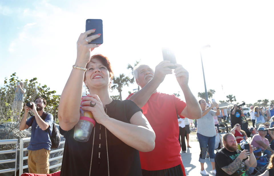 <p>Spectators at Cocoa Beach watch SpaceX’s first Falcon Heavy rocket launch from the Kennedy Space Center, Fla., Feb, 6, 2018. (Photo: Gregg Newton/Reuters) </p>