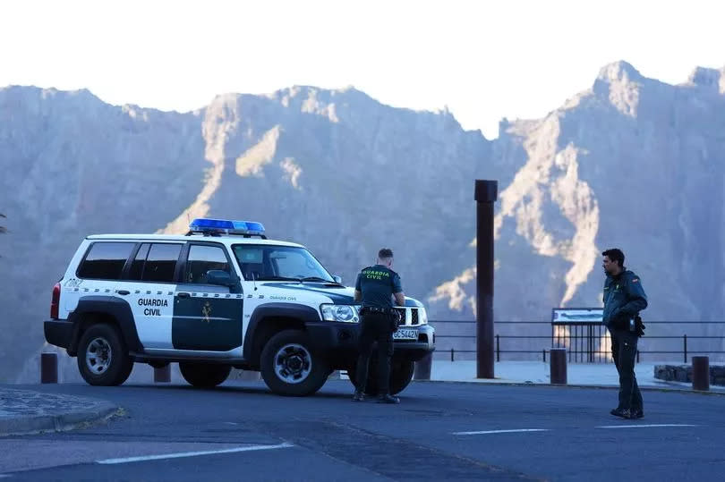 Emergency workers near the village of Masca