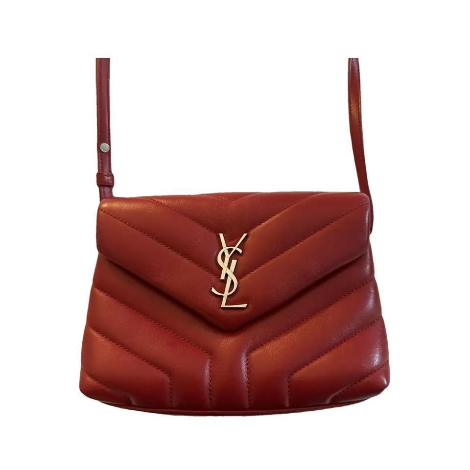 <p><a href="https://go.redirectingat.com?id=74968X1596630&url=https%3A%2F%2Fus.vestiairecollective.com%2Fwomen-bags%2Fhandbags%2Fsaint-laurent%2Fred-leather-loulou-saint-laurent-handbag-39941746.shtml%3F_gl%3D1%252Ahvdp50%252A_up%252AMQ..%26gclid%3DCjwKCAiAqNSsBhAvEiwAn_tmxeNAjQ8kjk2F_fhk_n8q_439kwE4cu_VcGtwpfUIRxAgGJinH7heLhoCo9gQAvD_BwE&sref=https%3A%2F%2F" rel="nofollow noopener" target="_blank" data-ylk="slk:Shop Now;elm:context_link;itc:0;sec:content-canvas" class="link ">Shop Now</a></p><p>Lou Lou Leather Crossbody Bag </p><p>vestiairecollective.com</p><p>$1254.75</p>