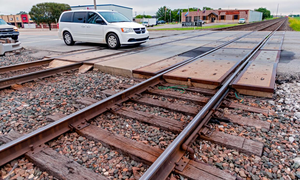 A vehicle crosses railroad tracks in Moore in this 2020 photo.