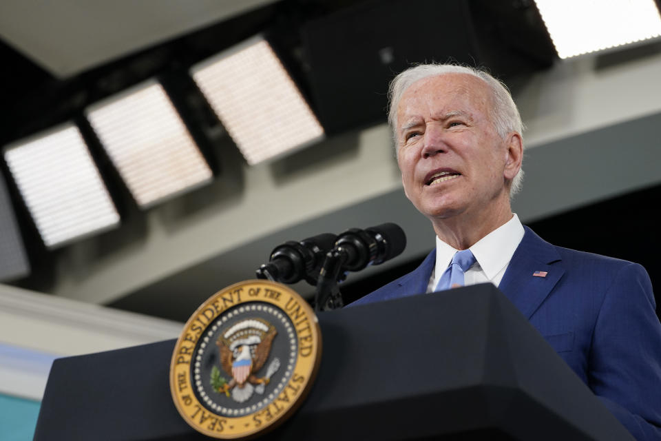 FILE - In this Oct. 8, 2021, file photo President Joe Biden speaks about the September jobs report from the South Court Auditorium on the White House campus in Washington. During an epidemic of ransomware attacks, the U.S. is sitting down to talk cybersecurity strategy this week with 30 countries while leaving out one key player: Russia. The country that, unwittingly or not, hosts many of the criminal syndicates behind ransomware attacks around the world was not invited to a two-day meeting starting Wednesday. (AP Photo/Susan Walsh, File)