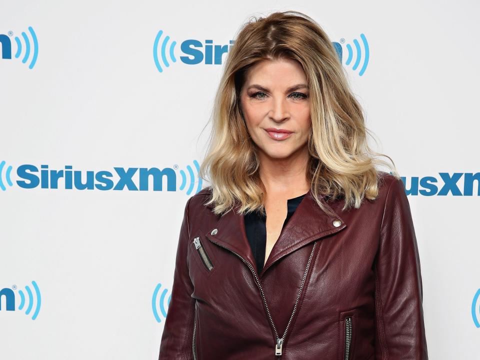 Kirstie Alley in a leather jacket