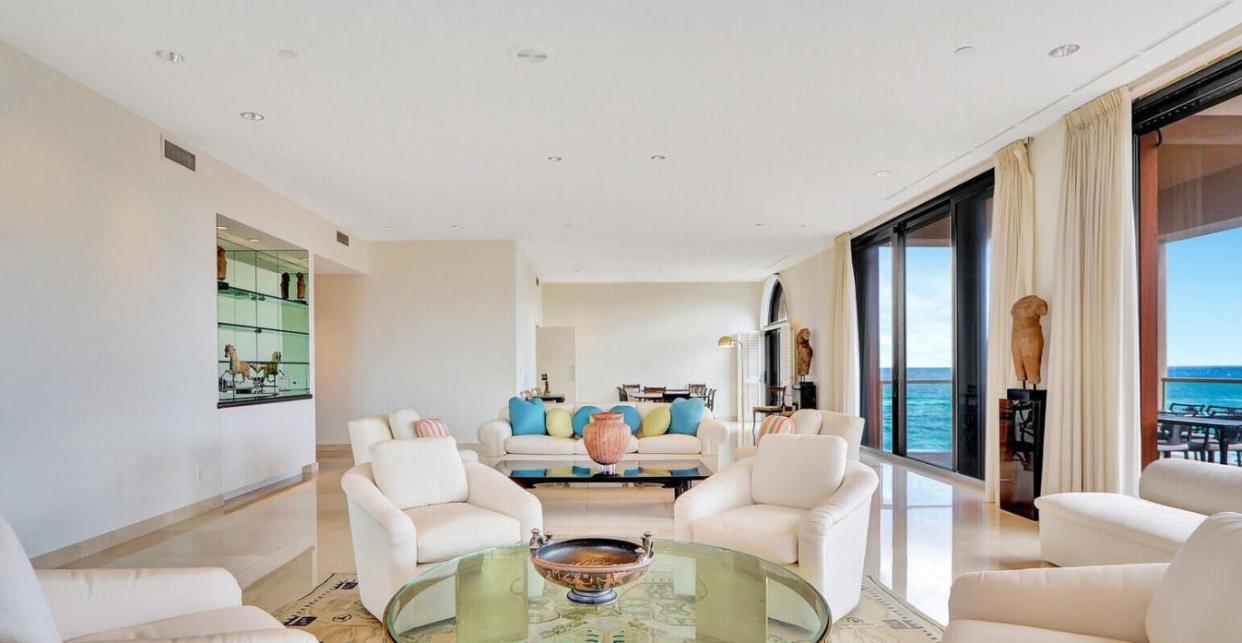 Glass doors in the oceanview living area of N-PH 4 at 2 N. Breakers Row in Palm Beach open to the private terrace. The condominium just sold for a recorded $14.75 million.