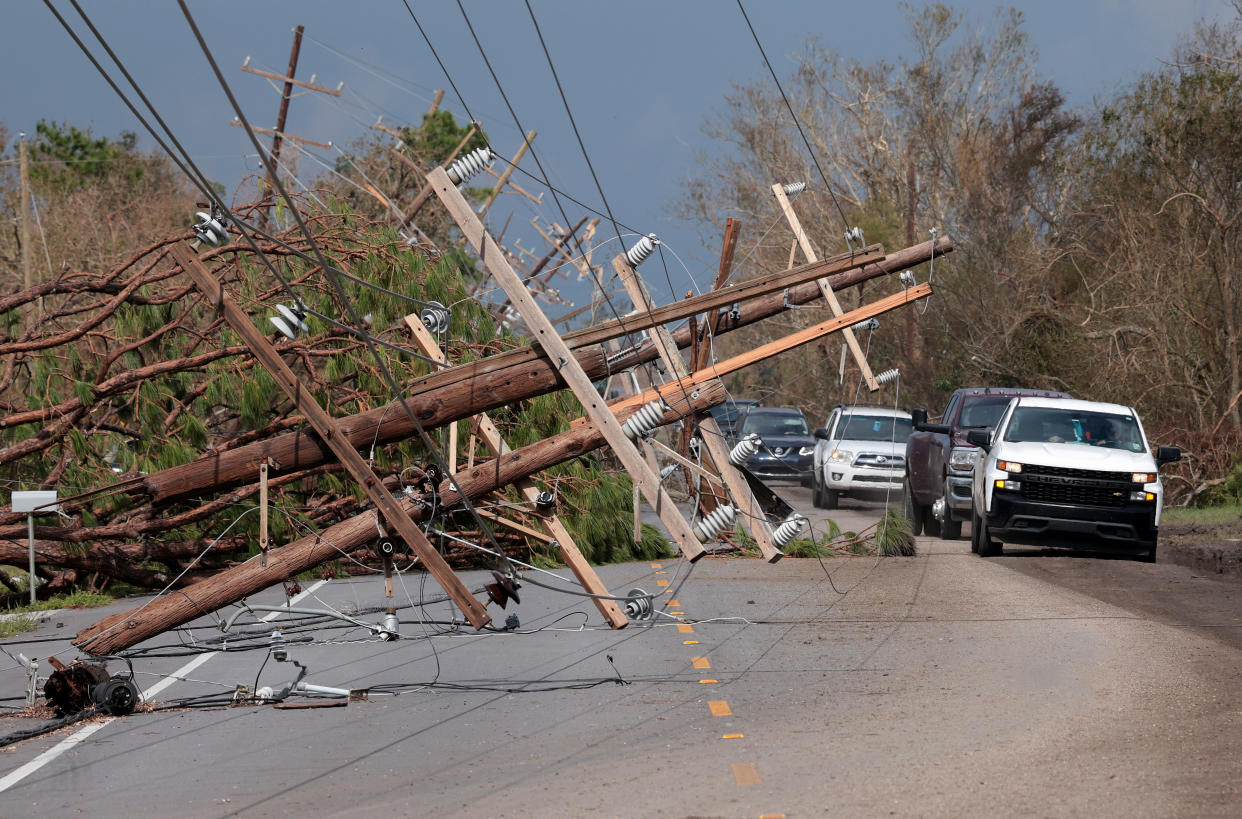 Fallen utility poles cross Highway 1 near Larose, La., following Hurricane Ida. (Win McNamee/Getty Images)