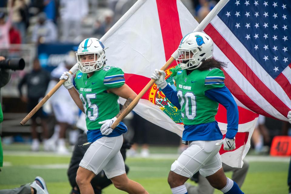 West Florida players take the field during first round of the 2022 NCAA Division II Football Championship against the Limestone Saints at Pen Air Field Saturday, November 19, 2022.. West Florida went on to beat Limestone 45-19.