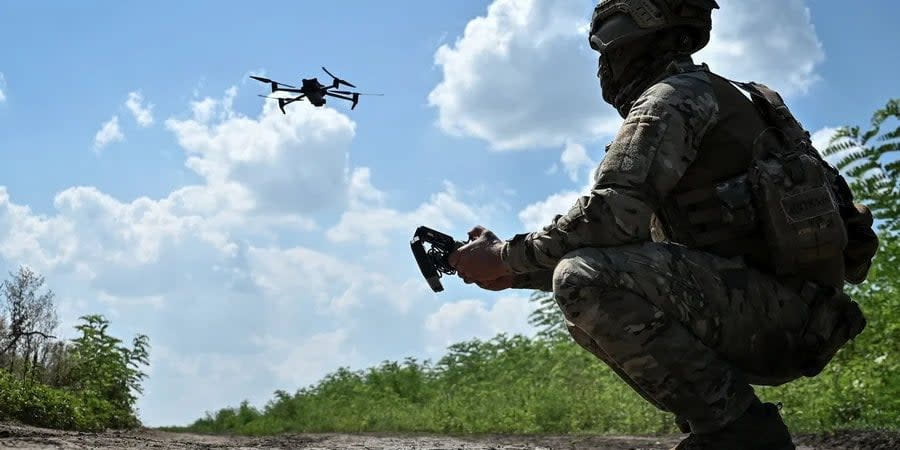 Ukrainian soldier launches a drone near the front line