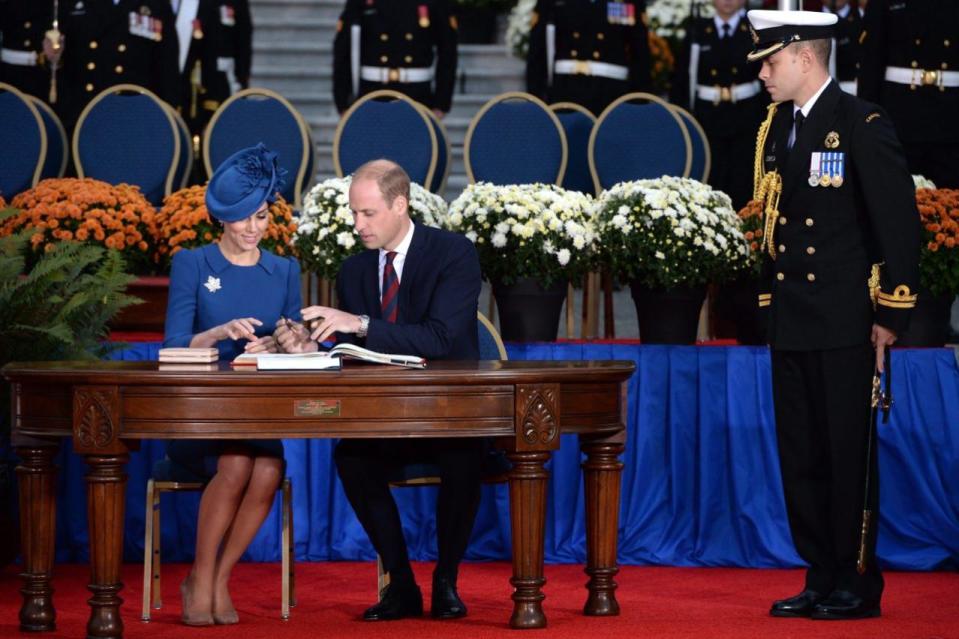 The Duke and Duchess of Cambridge sign the Canadian government’s Golden book at the Legislative Assembly in Victoria, B.C., Saturday, Sept 24, 2016. Photo: THE CANADIAN PRESS/Chad Hipolito