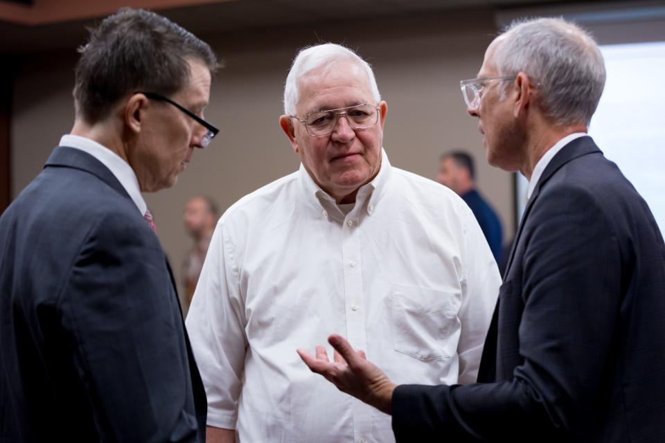 Ruben Garcia, director of Annunciation House, speaks with attorney Robert Doggett and Jerome Wesevich, a lawyer with Texas RioGrande Legal Aid representing Annunciation House, after a motion hearing with Judge Francisco Dominguez in the 205th District Courtroom in El Paso, TX on Thursday, March 7, 2024.