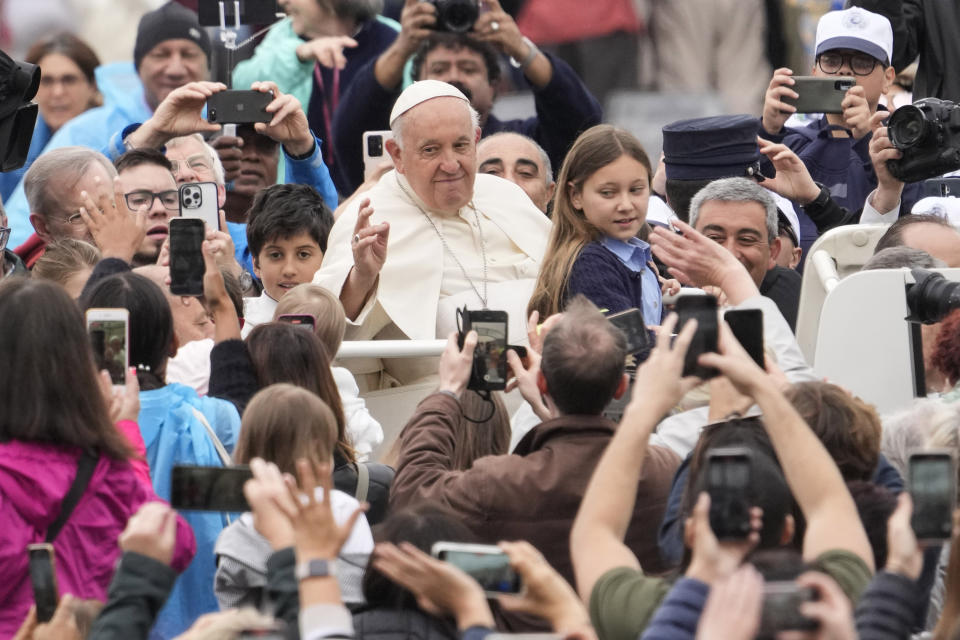 Pope Francis waves as he arrives for his weekly general audience in St. Peter's Square at The Vatican, Wednesday, May 17, 2023. (AP Photo/Andrew Medichini)