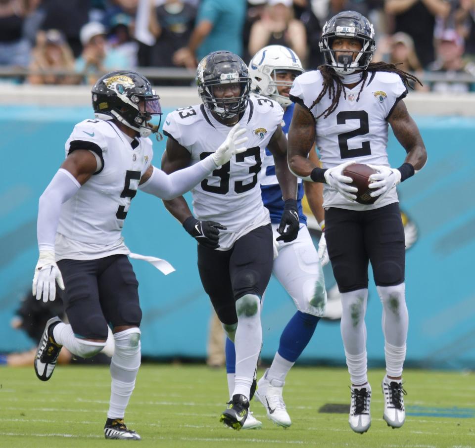 Jacksonville Jaguars safety Rayshawn Jenkins (2) on the field with teammates safety Andre Cisco (5) and linebacker Devin Lloyd (33) after intercepting an early first quarter Colts pass. The Jaguars went into the first half with a 17 to 0 lead over the Colts. The Jacksonville Jaguars hosted the Indianapolis Colts at TIAA Bank field in Jacksonville, FL Sunday, September 18, 2022. [Bob Self/Florida Times-Union]