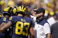 Michigan head coach Jim Harbaugh congratulates his players after a touchdown during the second half of an NCAA college football game against Colorado State, Saturday, Sept. 3, 2022, in Ann Arbor, Mich. (AP Photo/Carlos Osorio)