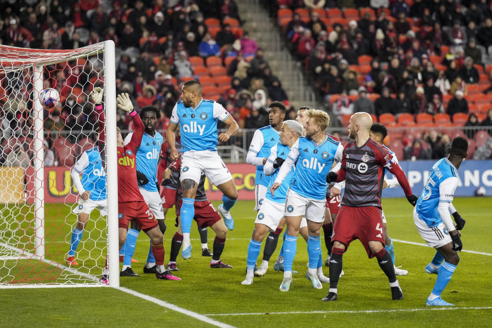 Toronto FC midfielder Michael Bradley (4) watches as his header beats Charlotte FC goalkeeper George Marks (31) during first-half MLS soccer match action in Toronto, Saturday, April 1, 2023. (Andrew Lahodynskyj/The Canadian Press via AP)