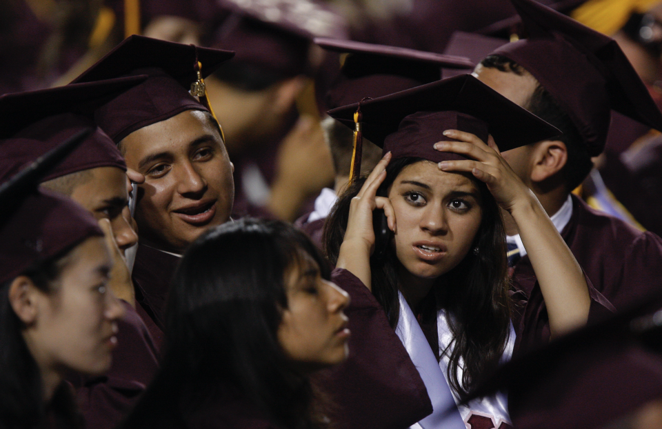 Arizona State University graduate students are seen in their seats during their graduation ceremony in Tempe, Arizona.(Photo by Joshua Lott/Getty Images) 