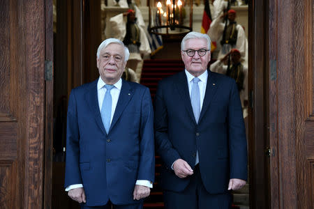 Greek President Prokopis Pavlopoulos welcomes German President Frank-Walter Steinmeier at the Presidential Palace in Athens, Greece, October 11, 2018. REUTERS/Michalis Karagiannis/Pool