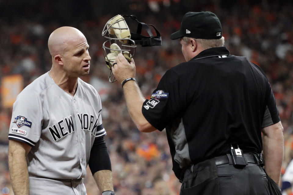 New York Yankees' Brett Gardner argues with home plate umpire Mark Carlson during the second inning in Game 6 of baseball's American League Championship Series against the Houston Astros Saturday, Oct. 19, 2019, in Houston. (AP Photo/Eric Gay)