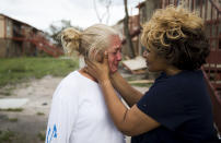 <p>Genice Gipson comforts her lifelong friend, Loretta Capistran, outside of Capistran’s apartment complex in Refugio, Texas, on Monday, Aug. 28, 2017. “We got to be strong, baby,” Gipson told Capistran. (Photo: Nick Wagner/Austin American-Statesman via AP) </p>