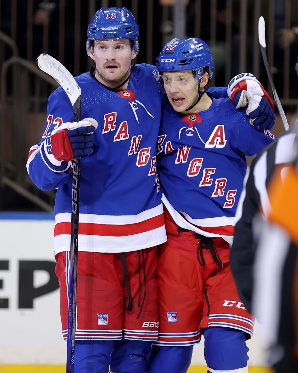 Mar 26, 2024; New York, New York, USA; New York Rangers left wing Alexis Lafreniere (13) celebrates his goal against the Philadelphia Flyers with left wing Artemi Panarin (10) during the third period at Madison Square Garden.