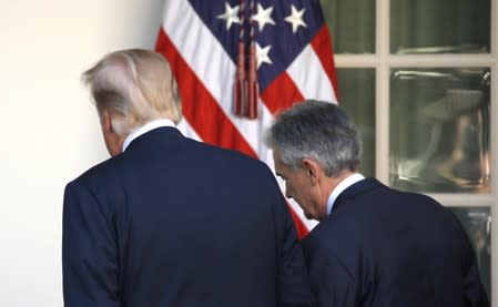 FILE PHOTO: U.S. President Donald Trump leaves the Rose Garden with Jerome Powell, his nominee to become chairman of the U.S. Federal Reserve at the White House in Washington