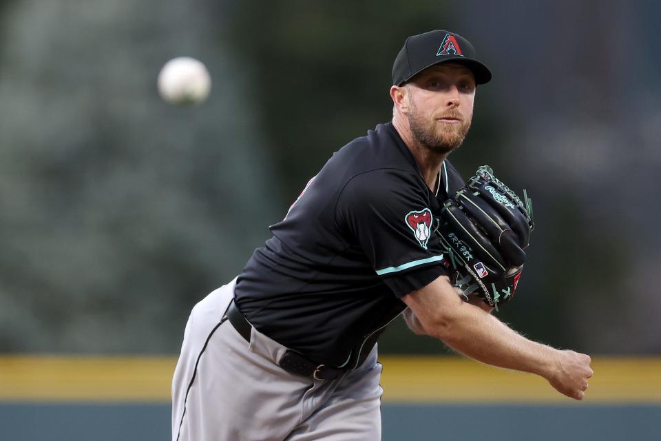 Starting pitcher Merrill Kelly #29 of the Arizona Diamondbacks throws against the Colorado Rockies in the first inning at Coors Field on April 09, 2024 in Denver, Colorado.