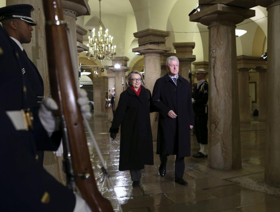 Secretary of State Hillary Clinton and her husband attend Obama’s 2013 swearing-in ceremony