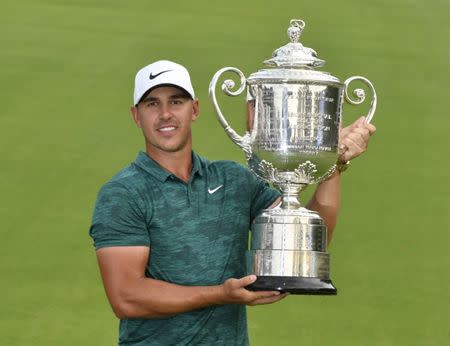 Aug 12, 2018; Saint Louis, MO, USA; Brooks Koepka poses with the Wanamaker Trophy after winning the PGA Championship golf tournament at Bellerive Country Club. Mandatory Credit: Jeff Curry-USA TODAY Sports