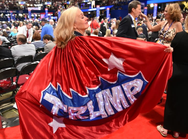 Mary Sue Rehrer wears a Donald Trump cape before the start of the final night at the Republican National Convention at the Quicken Loans Arena in Cleveland, Ohio on July 21, 2016