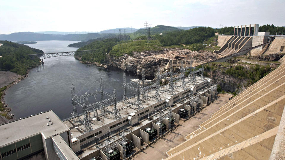 FILE - dam generates power along the Manicouagan River north of Baie-Comeau, Quebec, June 22, 2010. Importing more of Canada's historically abundant hydroelectricity is seen by some as a key component to making the U.S. electric grid carbon-free by 2035, as well as improving energy reliability and cost for American consumers. (Jacques Boissinot/The Canadian Press via AP, File)