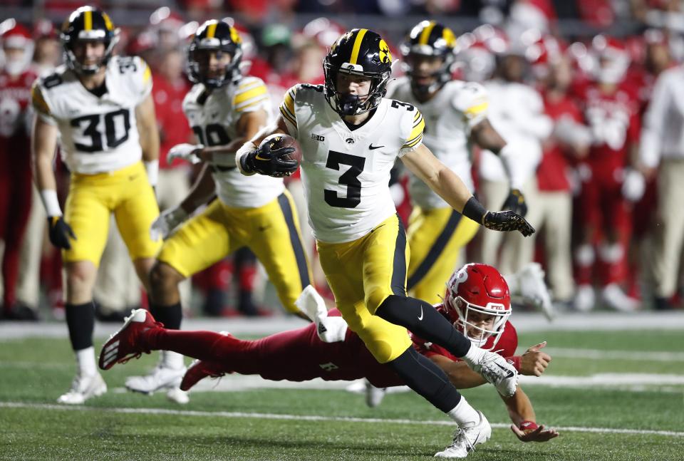 Iowa defensive back Cooper DeJean returns an interception for a touchdown against Rutgers Saturday, Sept. 24, 2022, in Piscataway, N.J. The Hawkeyes will play host to Utah State in their season opener on Saturday. | Noah K. Murray, Associated Press