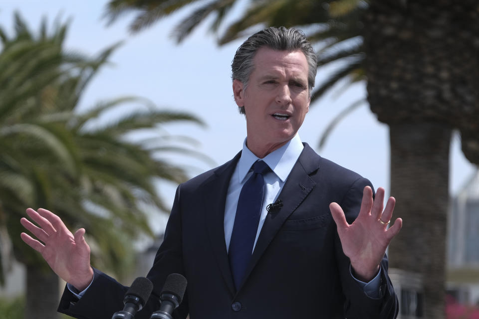 FILE - In this Tuesday, June 15, 2021, file photo, California Gov. Gavin Newsom talks during a news conference at Universal Studios in Universal City, Calif. Newsom and state legislative leaders are negotiating about whether to extend the state's ban on evictions for unpaid rent. California's eviction protections will expire on June 30. Newsom has proposed using federal coronavirus aid money to pay off 100% of the rent people owe. (AP Photo/Ringo H.W. Chiu, File)