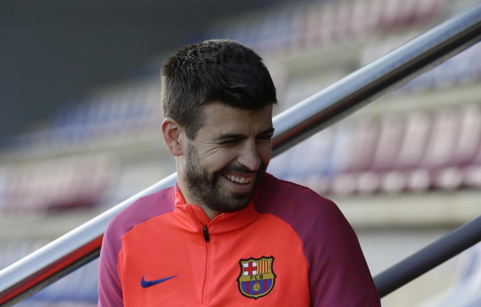 FC Barcelona's Gerard Pique smiles during a training session at the Sports Center FC Barcelona Joan Gamper in Sant Joan Despi, Spain, Saturday, Jan. 7, 2017. Villarreal will play against FC Barcelona in a Spanish La Liga on Sunday. (AP Photo/Manu Fernandez)