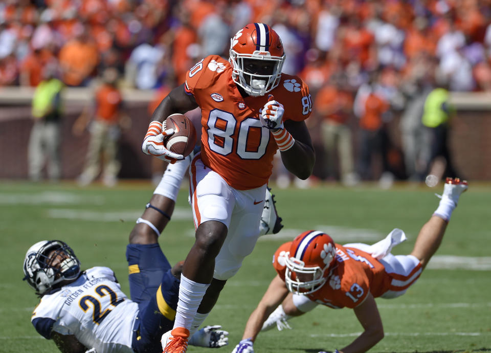 Clemson’s Milan Richardson (80) evades Kent State’s Jim Jones (22) after a reception with blocking help from Hunter Renfrow. (AP)