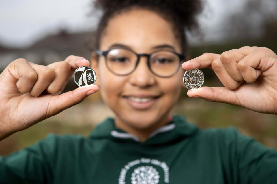 Picture shows children at Saltford C of E Primary School in Bristol, with the new Platinum Jubilee 50p which will be gifted to 7,000 children completing the QGC Forestry Award.