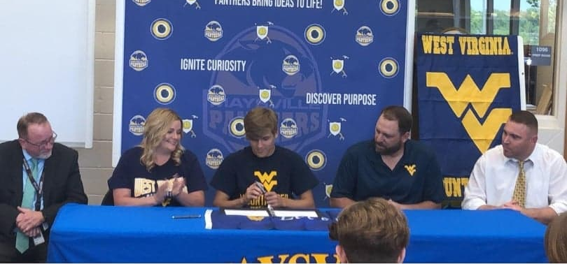 Maysville senior Colton Smitley (middle) signed his letter of intent to be a preferred walk-on at West Virginia.