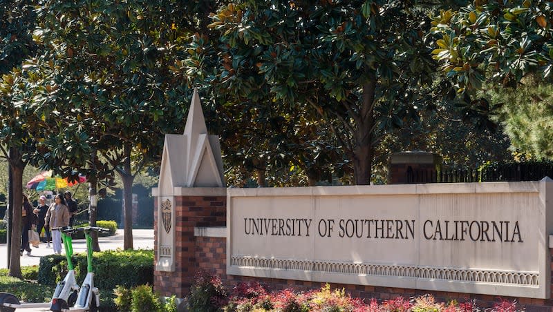 The name for the University of Southern California is displayed at a campus entrance in Los Angeles, Tuesday, April 16, 2024. University of Southern California officials have canceled a commencement speech by its 2024 valedictorian, a pro-Palestinian Muslim, citing "substantial risks relating to security and disruption" of the event that draws 65,000 people to campus.