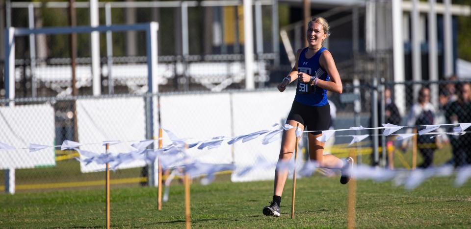 Sienna Audrey from the Community School of Naples leads the FHSAA 1A District 6 Cross Country meet at Southwest Florida Christian Academy in Fort Myers on Thursday, Nov. 2, 2023. She won. Community School of Naples girls also won as a team.