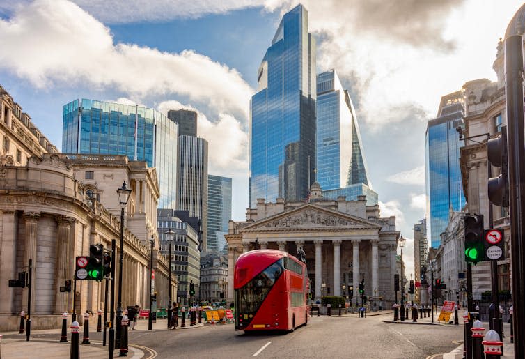 The City of London showing The Royal Exchange and a London bus