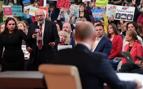 Mr Putin staged his annual marathon press conference - Credit: Alexei Druzhinin, Sputnik, Kremlin Pool Photo via AP