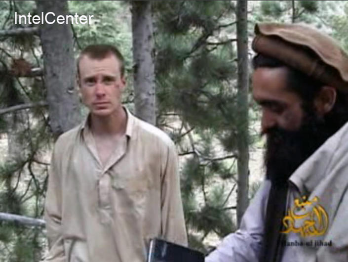 This image made from video released by the Taliban and obtained by IntelCenter on Dec. 8, 2010, shows a man believed to be Bowe Bergdahl at left. Bergdahl, a U.S. Army soldier, went missing from his outpost in Afghanistan in June 2009 and was released from Taliban captivity on May 31, 2014 in exchange for five enemy combatants held in the U.S. prison in Guantanamo Bay, Cuba. (AP Photo/IntelCenter, File) 