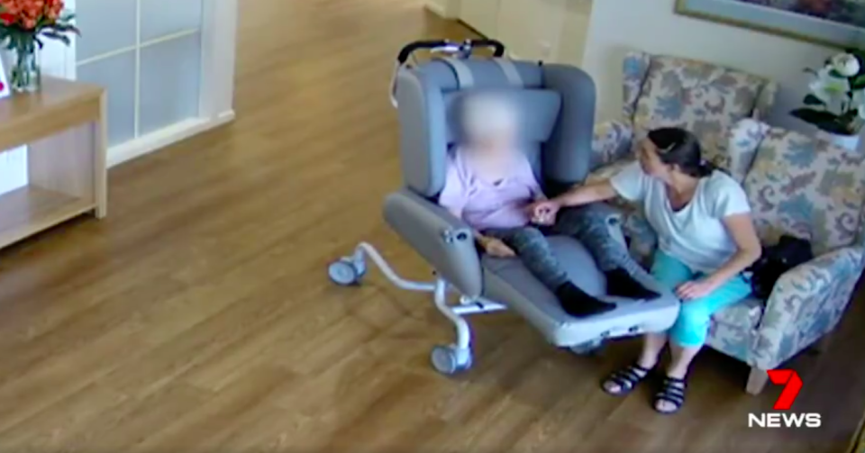 CCTV footage shows Moschones holding the great grandmother’s hand art her nursing home. Source: 7News