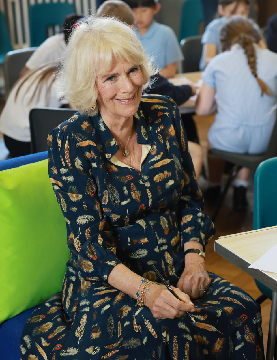 Queen Camilla at a reading event with children