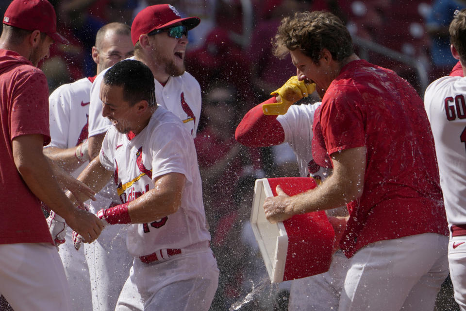 St. Louis Cardinals' Tommy Edman is splashed by starting pitcher Miles Mikolas, right, after hitting a walk-off two-run home run to defeat the San Diego Padres 5-4 in a baseball game Wednesday, Aug. 30, 2023, in St. Louis. (AP Photo/Jeff Roberson)