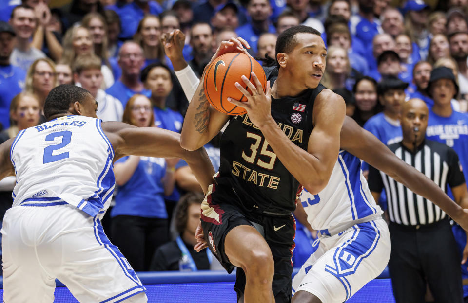 Florida State's Matthew Cleveland (35) drives past Duke's Jaylen Blakes (2) during the first half of an NCAA college basketball game in Durham, N.C., Saturday, Dec. 31, 2022. (AP Photo/Ben McKeown)