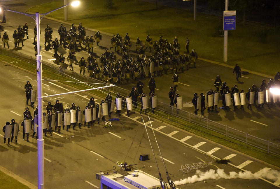 Police block a square during a mass protest following the presidential election in Minsk, Belarus, late Monday, Aug. 10, 2020. Thousands of people have protested in Belarus for a second straight night after official results from weekend elections gave an overwhelming victory to authoritarian President Alexander Lukashenko, extending his 26-year rule. A heavy police contingent blocked central squares and avenues, moving quickly to disperse protesters and detained dozens. (AP Photo)