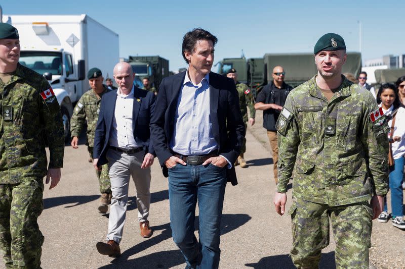 Canada's Prime Minister Justin Trudeau speaks with Canadian Forces personnel