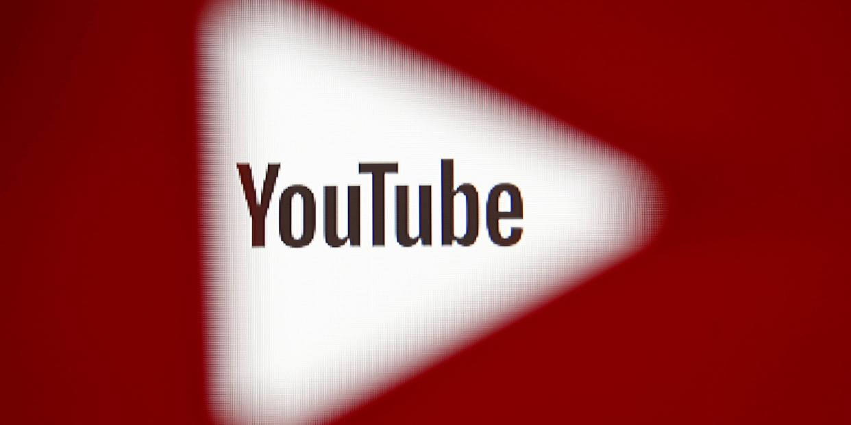 FILE PHOTO: A 3D-printed YouTube icon is seen in front of a displayed YouTube logo in this illustration taken October 25, 2017. REUTERS/Dado Ruvic/Ilustration/File Photo