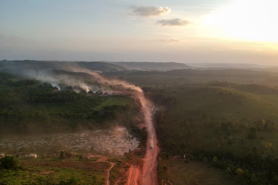 TOPSHOT - In this aerial view the red dust of the BR230 highway, known as "Transamazonica", mixes with fires at sunset in the agriculture town of Ruropolis, Para state, northen Brazil, on September 6, 2019. - Presidents and ministers from seven Amazon countries met in Colombia on Friday to agree on  measures to protect the world's biggest rainforest, under threat from wildfires and rampant deforestation. The summit took place in the wake of an international outcry over months of raging fires that have devastated swaths of the Amazon in Brazil and Bolivia. (Photo by Johannes MYBURGH / AFP)        (Photo credit should read JOHANNES MYBURGH/AFP/Getty Images)