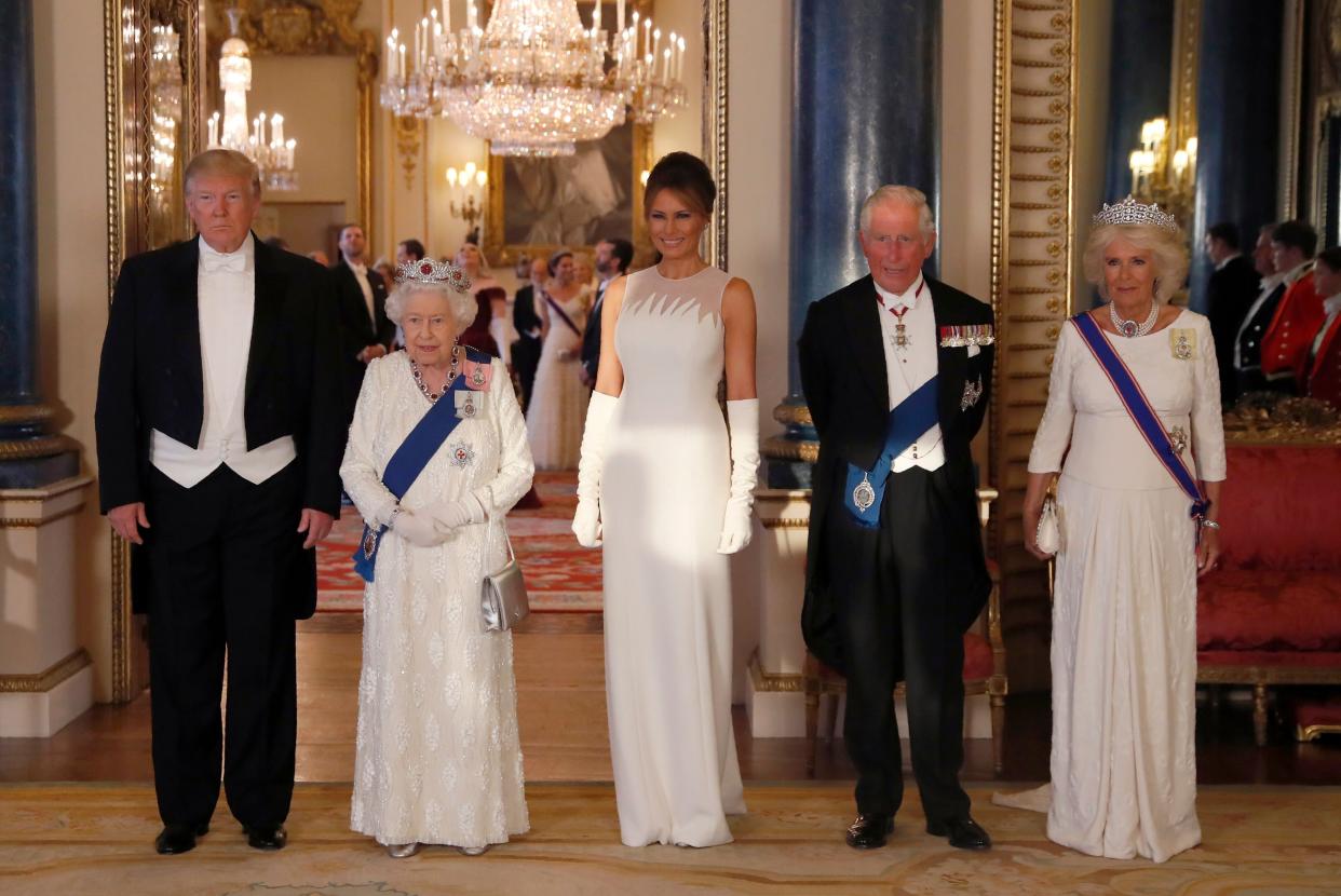 Britain's Queen Elizabeth II (2L), US President Donald Trump (L), US First Lady Melania Trump (C), Britain's Prince Charles, Prince of Wales (2R) and Britain's Camilla, Duchess of Cornwall pose for a photograph ahead of a State Banquet in the ballroom at Buckingham Palace in central London on June 3, 2019, on the first day of the US president and First Lady's three-day State Visit to the UK. - Britain rolled out the red carpet for US President Donald Trump on June 3 as he arrived in Britain for a state visit already overshadowed by his outspoken remarks on Brexit. (Photo by Alastair Grant / POOL / AFP)        (Photo credit should read ALASTAIR GRANT/AFP/Getty Images)