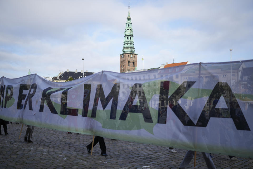 Participants in the People's Climate March rally in downtown Copenhagen, Denmark, Sunday, Oct. 30, 2022, ahead of the general election scheduled for Nov. 1, 2022. Denmark's election on Tuesday is expected to change its political landscape, with new parties hoping to enter parliament and others seeing their support dwindle. A former prime minister who left his party to create a new one this year could end up as a kingmaker, with his votes being needed to form a new government. (AP Photo/Sergei Grits)