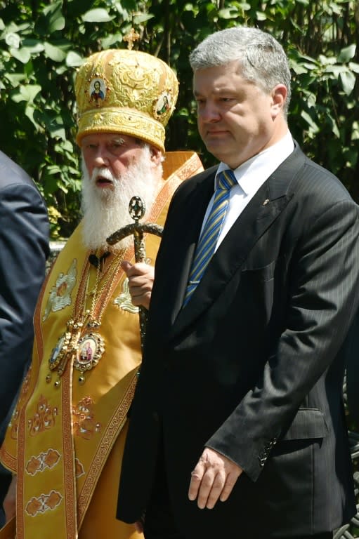 Patriarch Filaret's Kiev-based Church may not yet be recognised by Orthodox authorities, but it enjoys the support Ukrainian President Petro Poroshenko, who attend a religious procession in Kiev last month marking the 1030th anniversary of the Christianisation of Kievan Rus